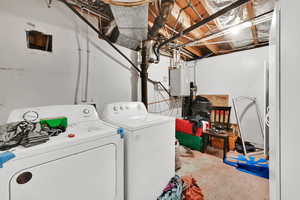 Laundry room with washing machine and clothes dryer