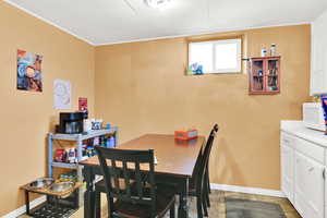 Dining space featuring baseboards and ornamental molding