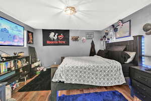 Bedroom featuring wood finished floors