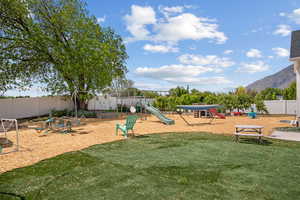 Backyard playground with a mountain view
