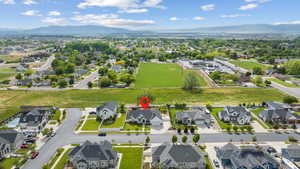 Aerial perspective of suburban area with a mountain backdrop