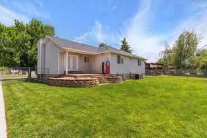 Back of property with cooling unit and french doors