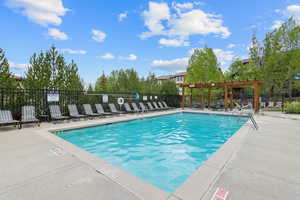 Community pool featuring a patio area