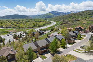 Aerial perspective of suburban area with a mountain backdrop