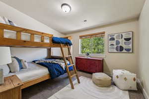 Bedroom featuring carpet flooring and baseboards
