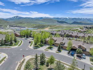 Aerial view of residential area featuring a mountain backdrop