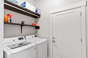 Laundry room featuring separate washer and dryer