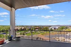 Wooden deck featuring a residential view and a mountain view