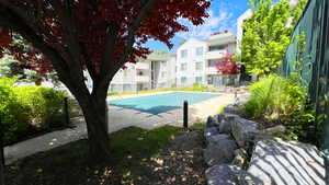Community pool featuring a residential view