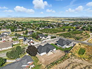Aerial view of property's location featuring nearby suburban area and rural landscape