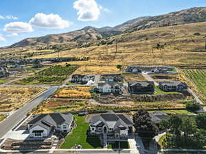 View of rural area with mountains and nearby suburban area