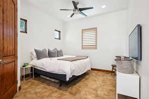 Bedroom featuring baseboards, tile patterned floors, ceiling fan, and recessed lighting