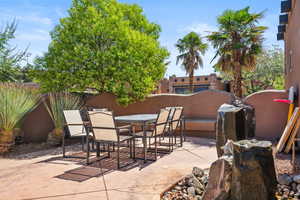View of patio with outdoor dining area