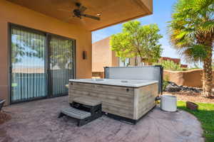 View of patio / terrace featuring a hot tub and ceiling fan