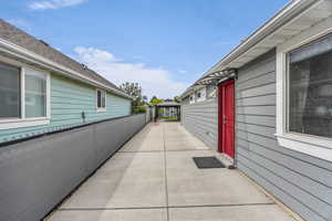 View of side of home with a patio