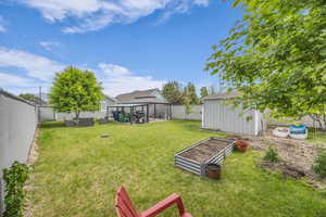 View of yard featuring a gazebo and a vegetable garden