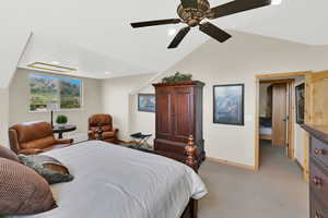 Bedroom with baseboards, light colored carpet, vaulted ceiling, a ceiling fan, and recessed lighting