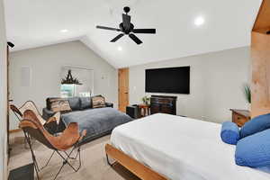Bedroom with vaulted ceiling, ceiling fan, recessed lighting, and carpet