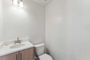 Half bath with toilet and vanity