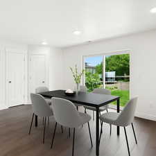 Dining area featuring recessed lighting and dark wood finished floors