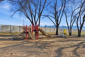 Communal playground featuring a mountain view
