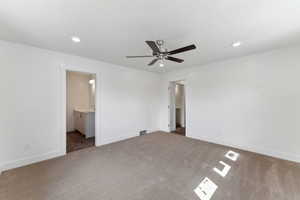Unfurnished bedroom featuring carpet, baseboards, a sink, recessed lighting, and connected bathroom