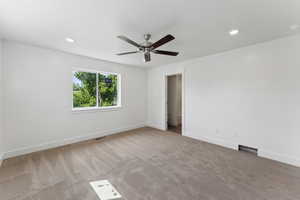 Unfurnished room with ceiling fan, carpet floors, baseboards, and recessed lighting
