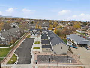 Aerial perspective of suburban area with a mountain backdrop