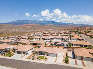 Aerial perspective of suburban area featuring a mountain backdrop