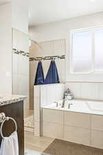 Bathroom with a bath and a walk in shower