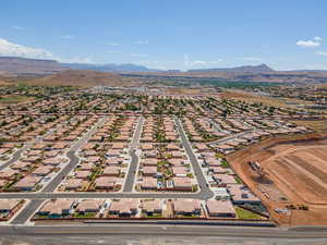 Aerial perspective of suburban area with a mountainous background