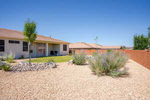 Back of house featuring stucco siding