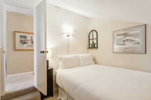 Bedroom with carpet flooring and baseboards