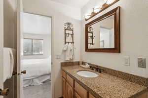 Ensuite bathroom featuring vanity