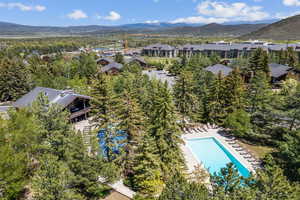 Bird's eye view of a mountain backdrop and a pool area