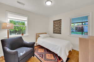 Bedroom with multiple windows and baseboards