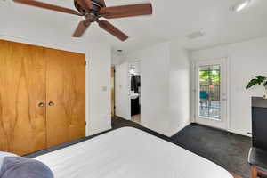 Bedroom featuring access to exterior, baseboards, dark carpet, and a ceiling fan