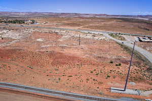 Aerial view of sparsely populated area featuring a mountainous background and a desert landscape