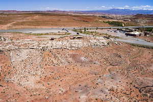 Aerial view of property's location with a mountainous background