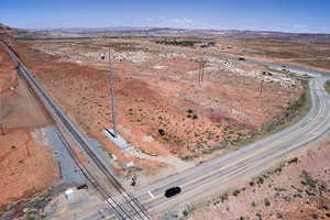Aerial view of property and surrounding area with rural landscape, mountains, and a desert landscape
