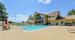 Community pool featuring a patio area