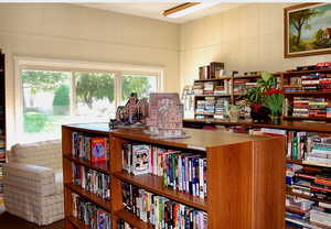 Office area featuring wall of books