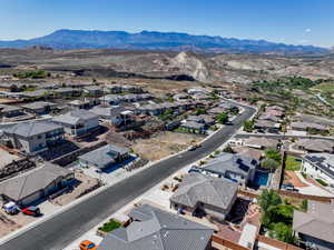 Aerial perspective of suburban area featuring a mountainous background
