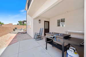 Fenced backyard featuring a patio area