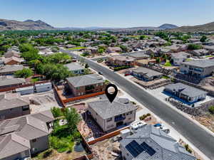 Aerial perspective of suburban area featuring a mountain backdrop