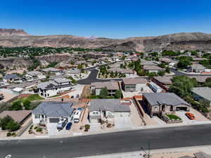 Aerial perspective of suburban area featuring a mountain backdrop