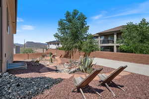 Fenced backyard with a patio and a mountain view