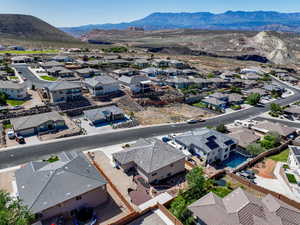 Aerial perspective of suburban area with a mountainous background