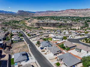 View of property location featuring mountains and nearby suburban area