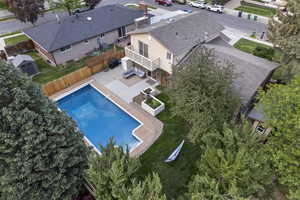 Aerial view of property and surrounding area with a pool